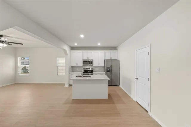 a view of a kitchen with electric appliances