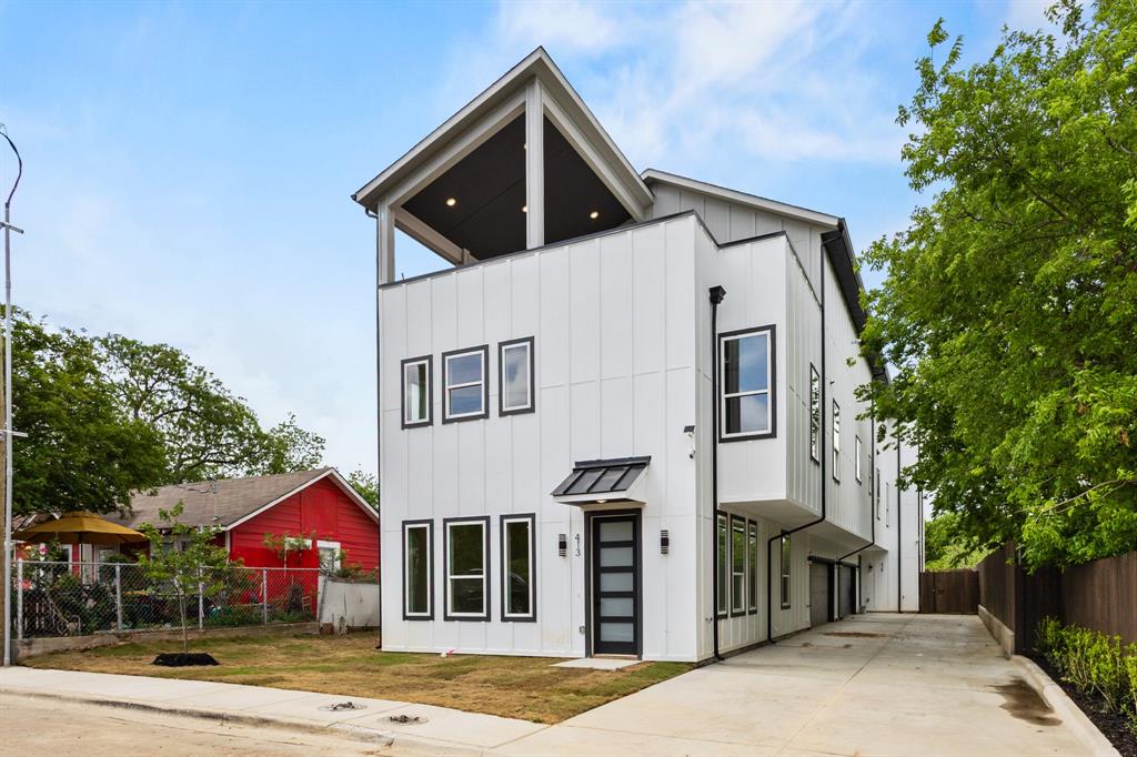 413 North Patton Avenue Dallas, TX 75203 - Photo 2 of 21 a front view of a house with a yard