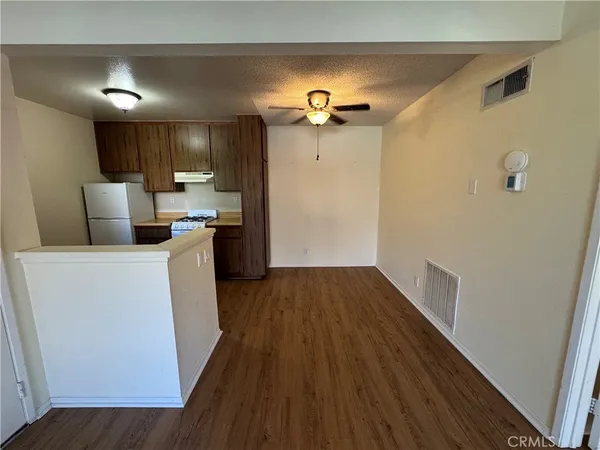 a view of a kitchen from the hallway