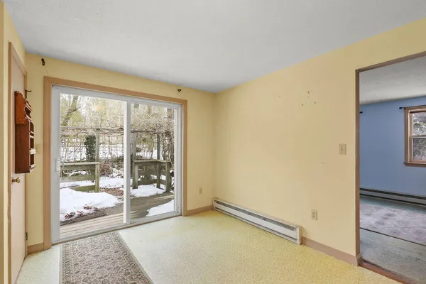 a dining room with furniture and window