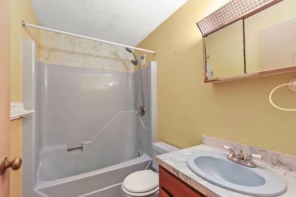 a view of an empty room with windows