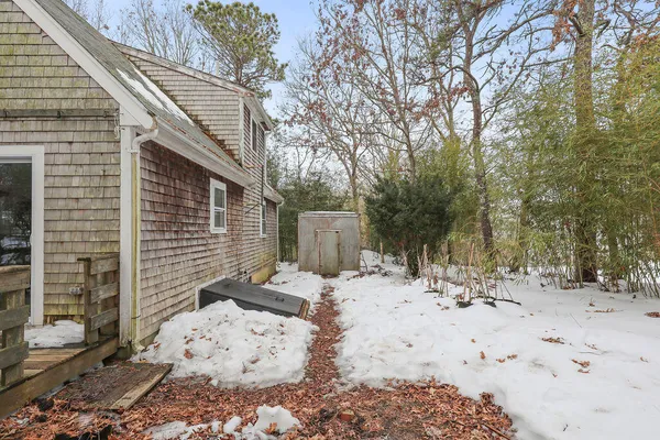 a view of a patio with snow on the road