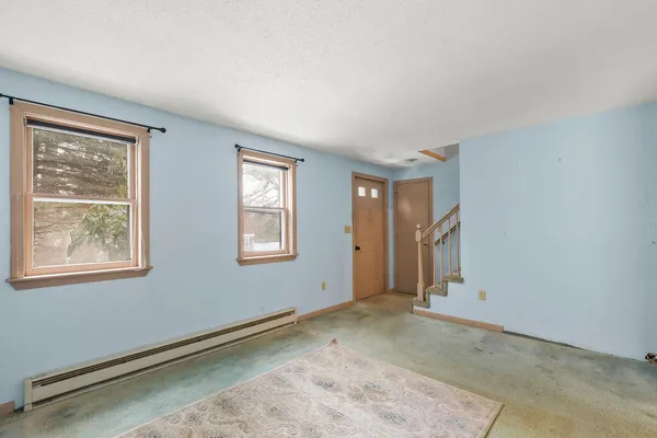 a large kitchen with a sink and cabinets