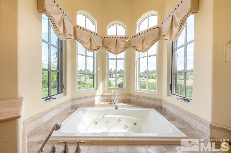1530 Boulder Field Way Reno, NV 89511 - Photo 12 of 21 a bathroom with a bathtub and windows