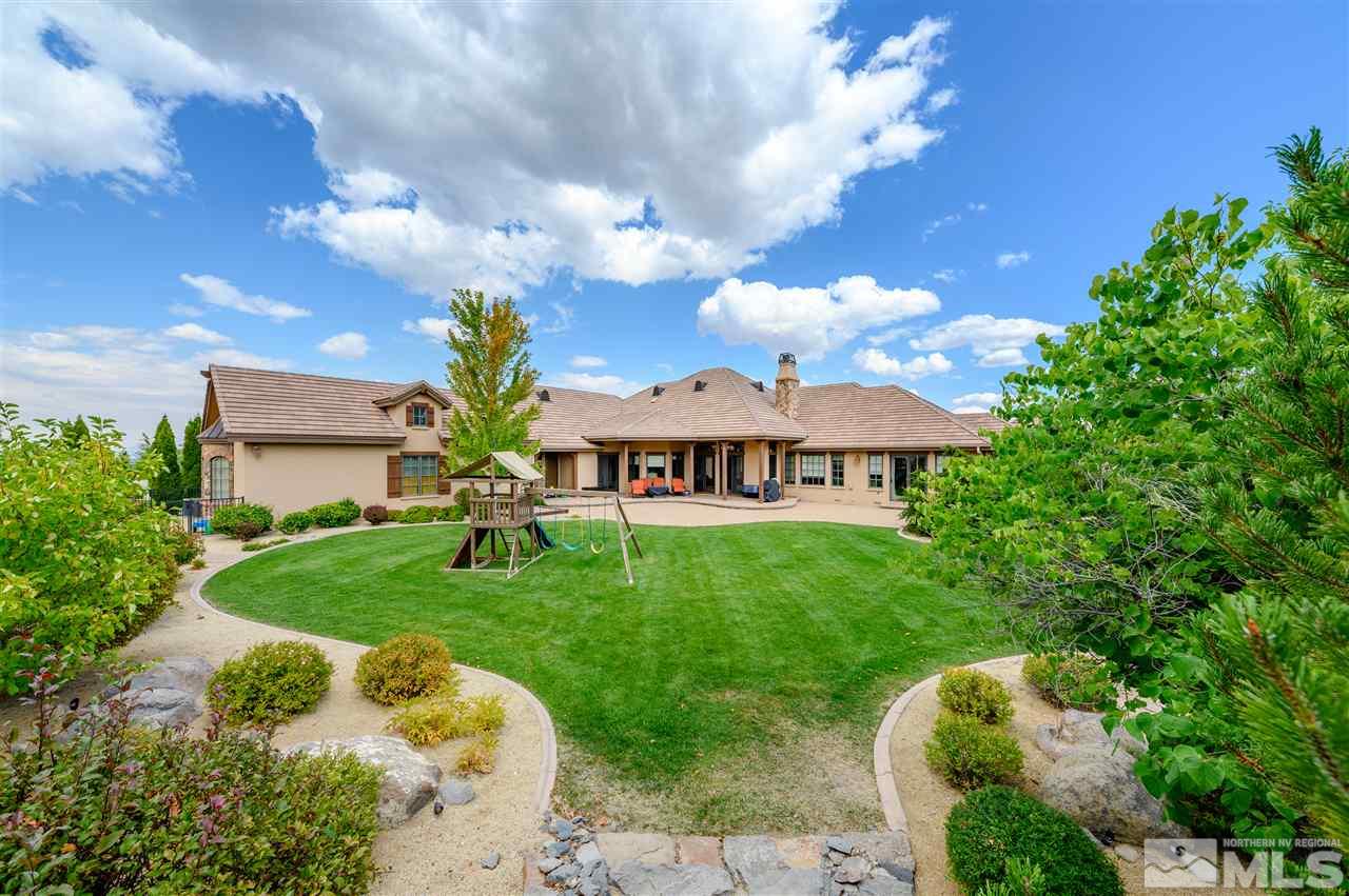 1530 Boulder Field Way Reno, NV 89511 - Photo 5 of 21 a view of a big house with a big yard and potted plants