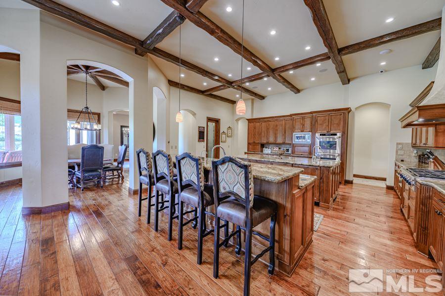1530 Boulder Field Way Reno, NV 89511 - Photo 9 of 21 a view of a dining area with furniture and wooden floor