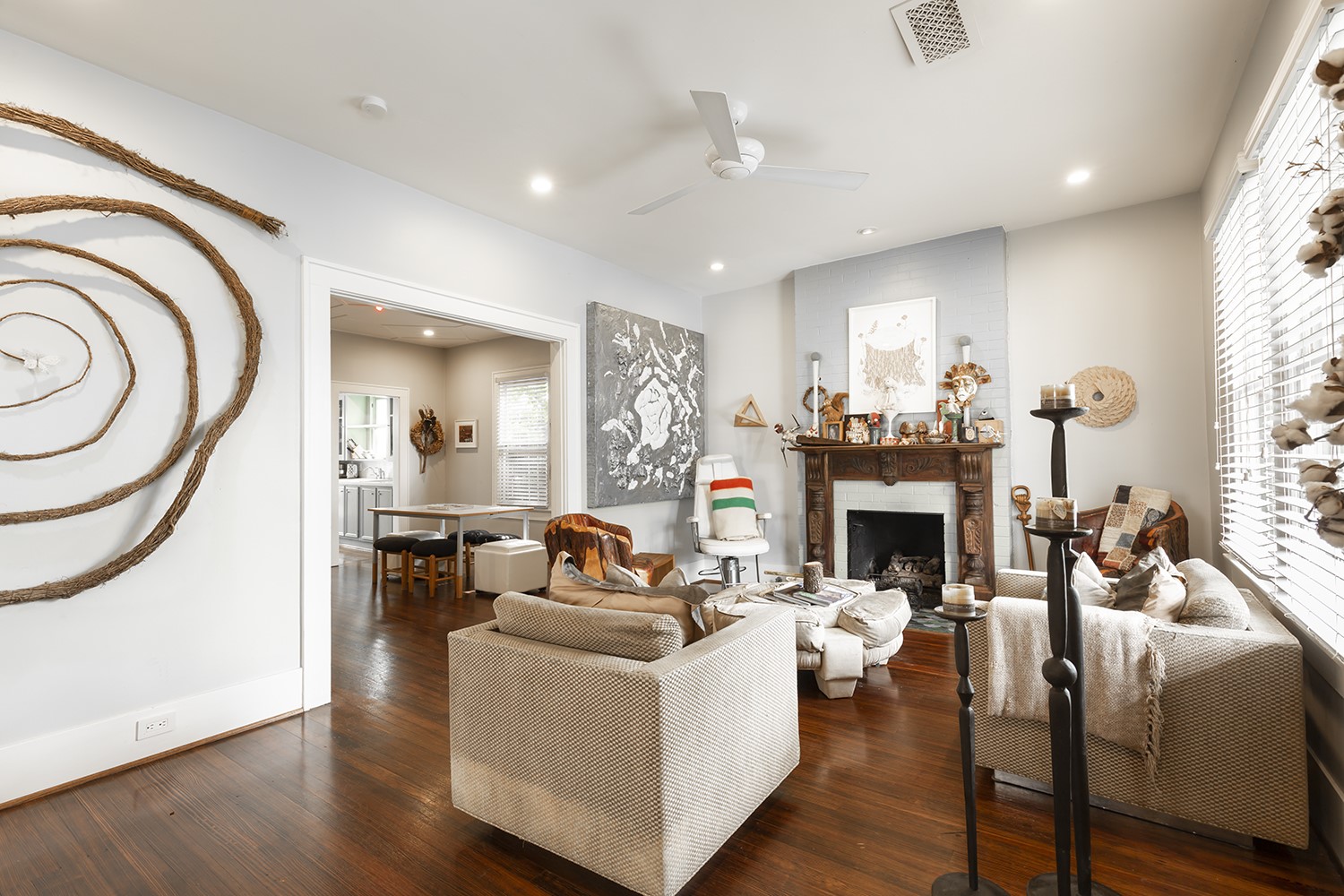 1209 Bomar Street Houston, TX 77006 - Photo 4 of 23 a living room with furniture a fireplace and a chandelier