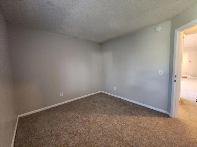 an empty room with a empty space and a window