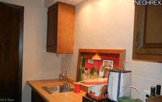 4210 Slaughter Road Uniontown, OH 44685 - Photo 23 of 25 Separate wet bar area off family room.