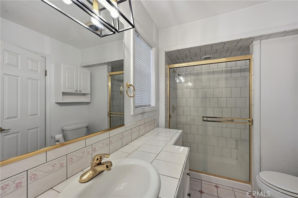 13674 Anderson Road Lower Lake, CA 95457 - Photo 18 of 38 a bathroom with a sink and mirror with toilet