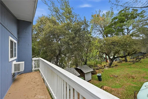 a view of a two chairs in the balcony