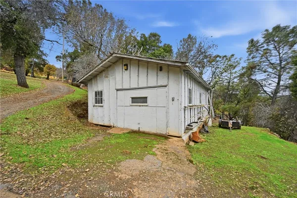 a house view with a backyard space