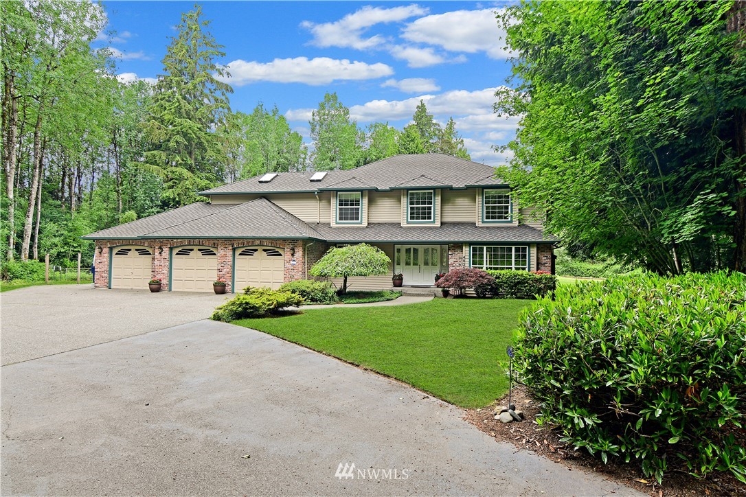 4025 204th Street Southeast Bothell, WA 98012 - Photo 1 of 35 a view of a house with garden