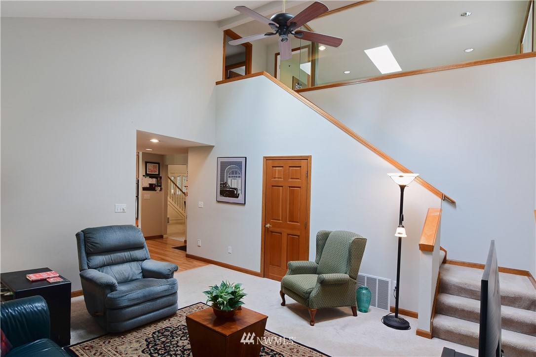 4025 204th Street Southeast Bothell, WA 98012 - Photo 13 of 35 a living room with furniture and wooden floor
