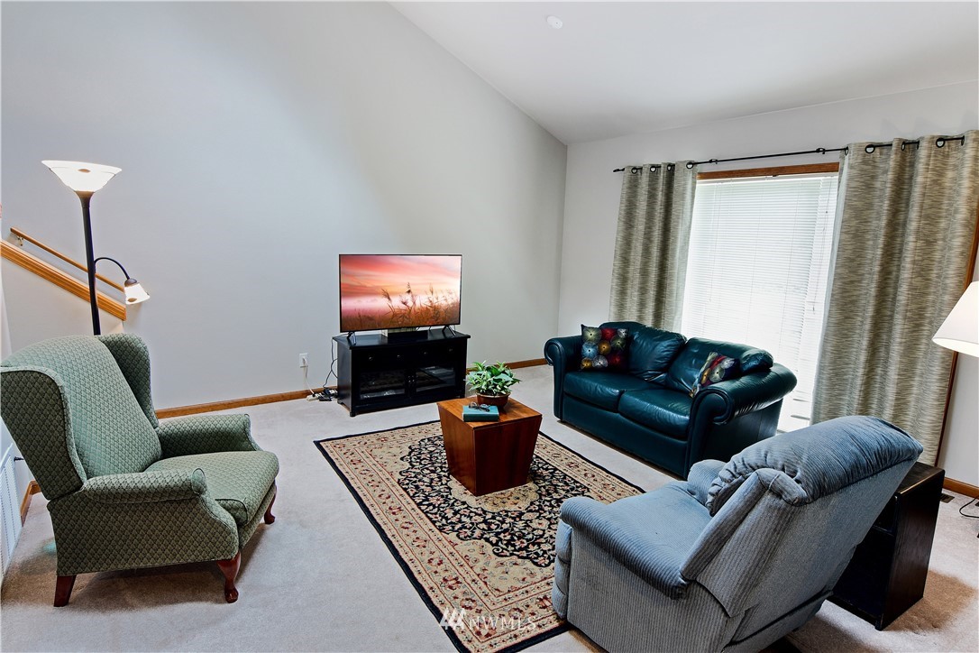 4025 204th Street Southeast Bothell, WA 98012 - Photo 14 of 35 a living room with furniture and a flat screen tv