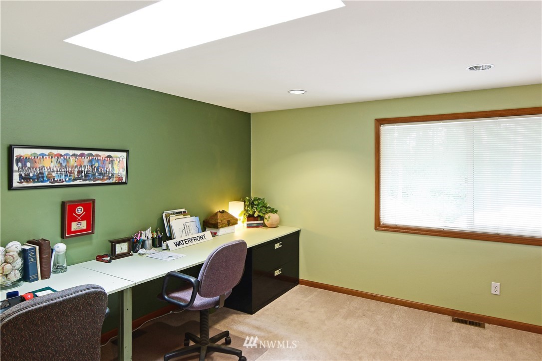 4025 204th Street Southeast Bothell, WA 98012 - Photo 16 of 35 a view of a workspace with furniture and a window