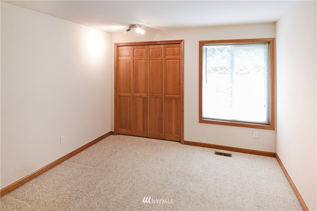 4025 204th Street Southeast Bothell, WA 98012 - Photo 18 of 35 an empty room with windows