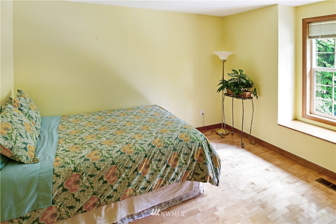 4025 204th Street Southeast Bothell, WA 98012 - Photo 20 of 35 a bedroom with a bed and a window