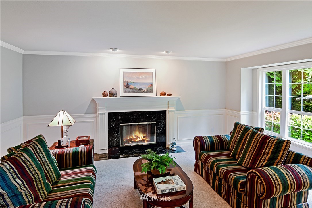 4025 204th Street Southeast Bothell, WA 98012 - Photo 3 of 35 a living room with furniture and a fireplace