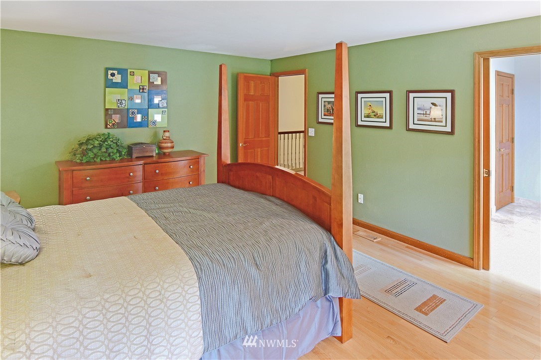 4025 204th Street Southeast Bothell, WA 98012 - Photo 23 of 35 a bed room with a bed and a dresser