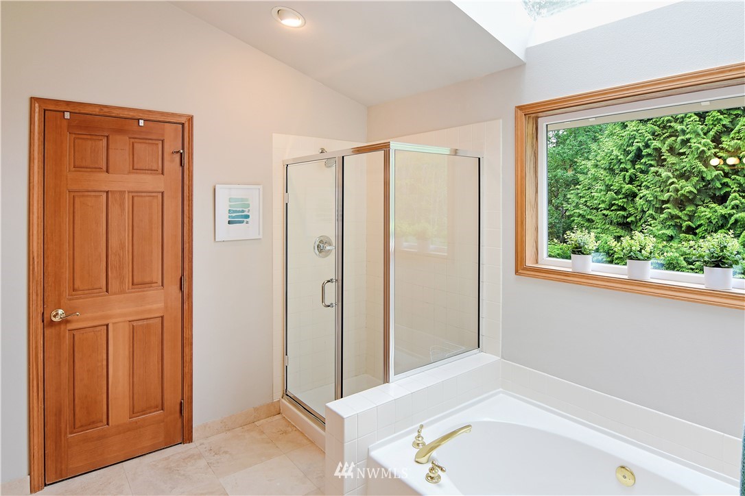 4025 204th Street Southeast Bothell, WA 98012 - Photo 24 of 35 a bathroom with a tub and shower