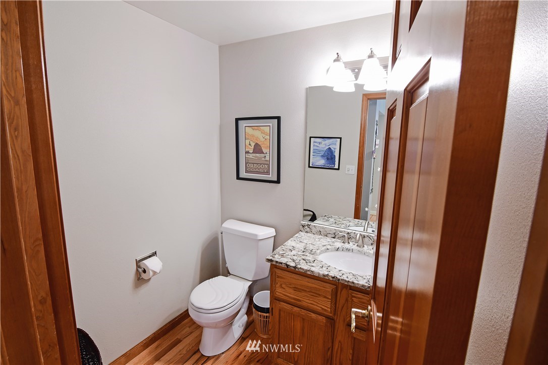 4025 204th Street Southeast Bothell, WA 98012 - Photo 26 of 35 a bathroom with a granite countertop toilet sink and vanity