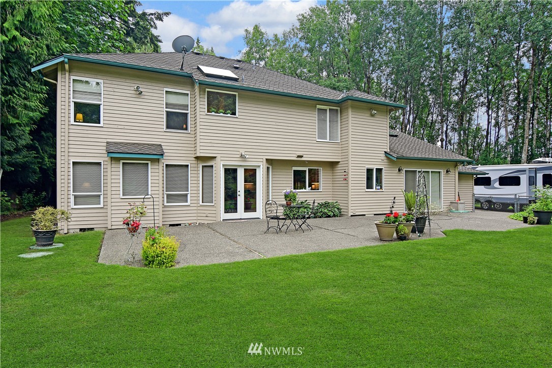4025 204th Street Southeast Bothell, WA 98012 - Photo 30 of 35 a front view of house with yard and outdoor seating