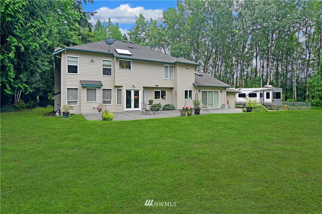 4025 204th Street Southeast Bothell, WA 98012 - Photo 31 of 35 a front view of a house with a yard