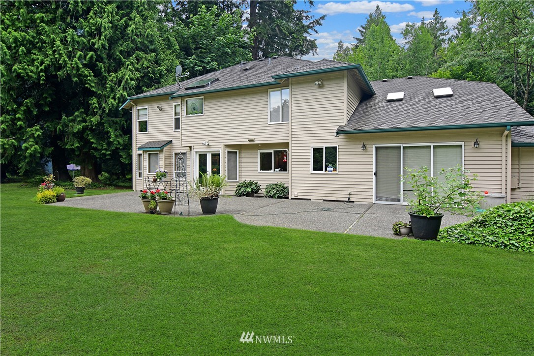 4025 204th Street Southeast Bothell, WA 98012 - Photo 32 of 35 a view of a house with a backyard