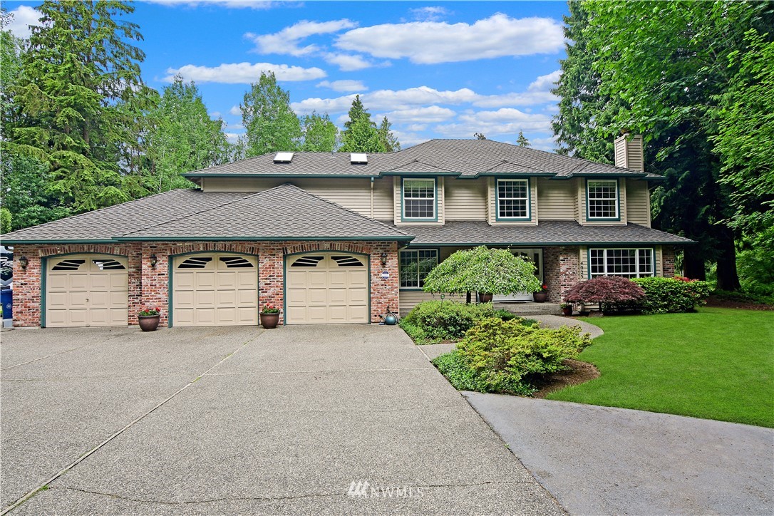 4025 204th Street Southeast Bothell, WA 98012 - Photo 35 of 35 front view of a house with a yard
