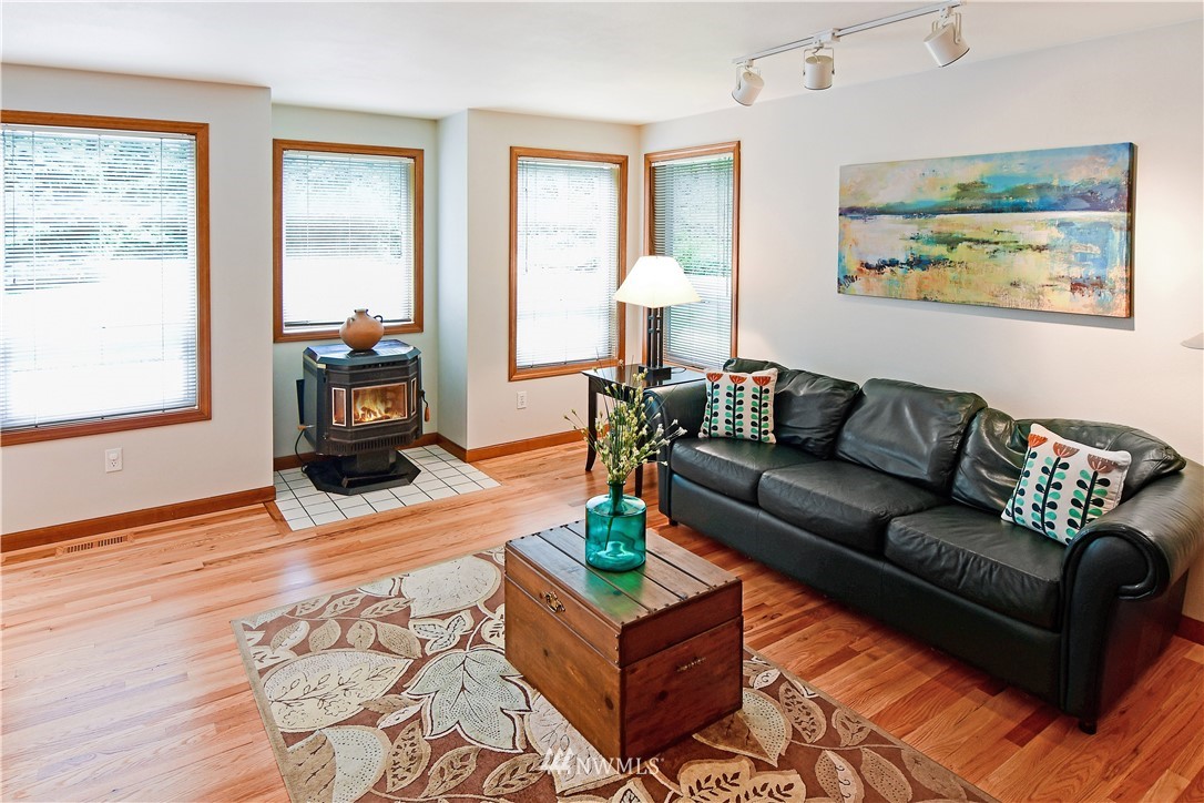 4025 204th Street Southeast Bothell, WA 98012 - Photo 7 of 35 a living room with furniture and a large window