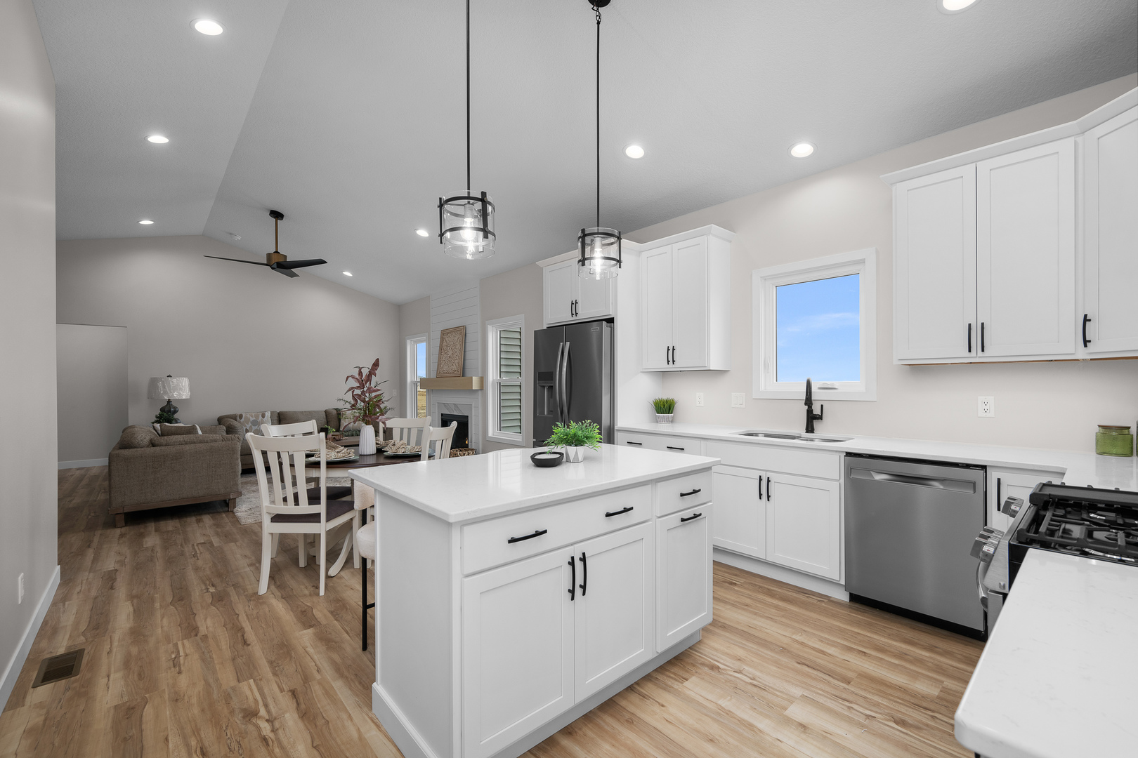 1832 Redbud Circle Eldridge, IA 52748 - Photo 11 of 35 a kitchen with a sink stove cabinets and wooden floor