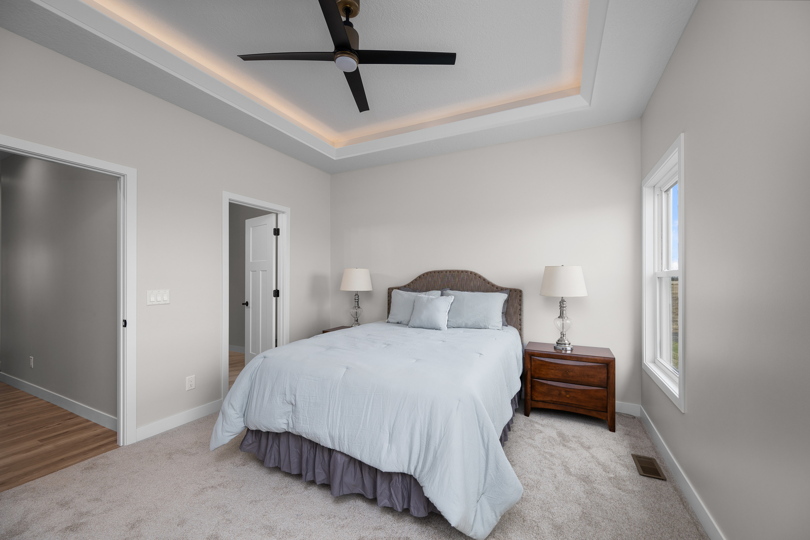 1832 Redbud Circle Eldridge, IA 52748 - Photo 19 of 35 a bedroom with a bed and a chandelier