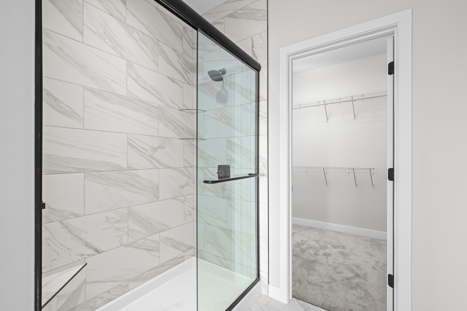 1832 Redbud Circle Eldridge, IA 52748 - Photo 22 of 35 a bathroom with a glass shower door