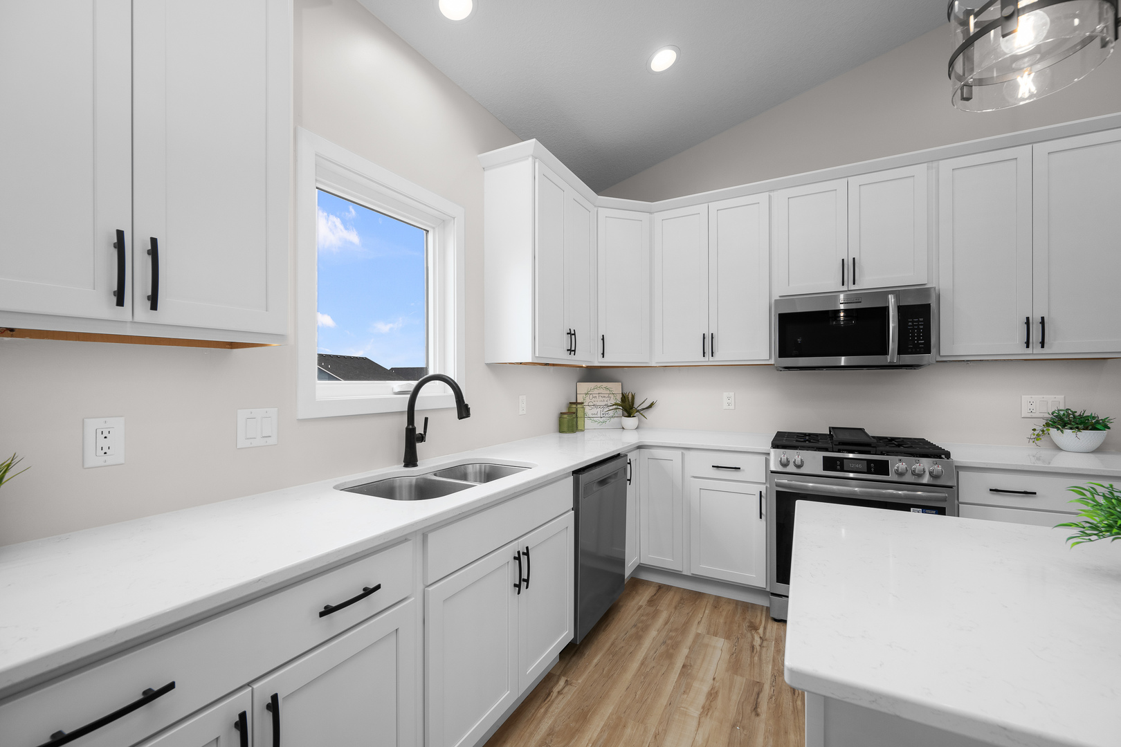 1832 Redbud Circle Eldridge, IA 52748 - Photo 10 of 35 a kitchen with sink a microwave and cabinets