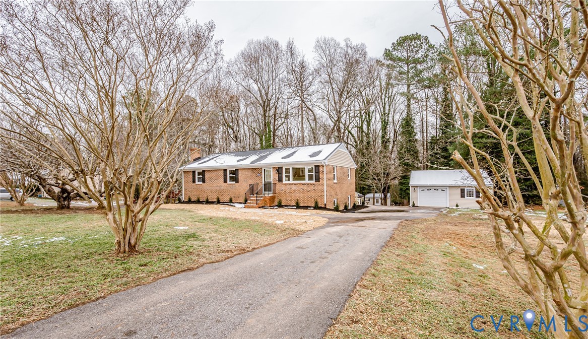 11251 Celtic Road Chesterfield, VA 23838 - Photo 2 of 49 a front view of a house with a yard and large trees
