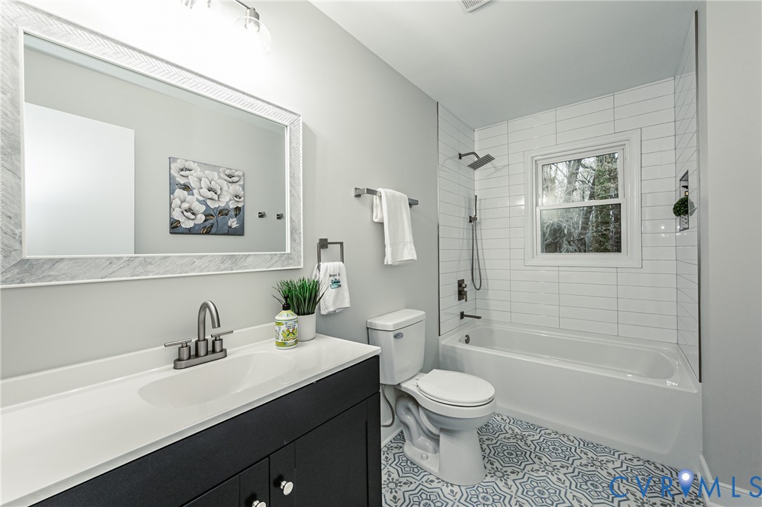 11251 Celtic Road Chesterfield, VA 23838 - Photo 22 of 49 a bathroom with a sink a toilet and a bathtub