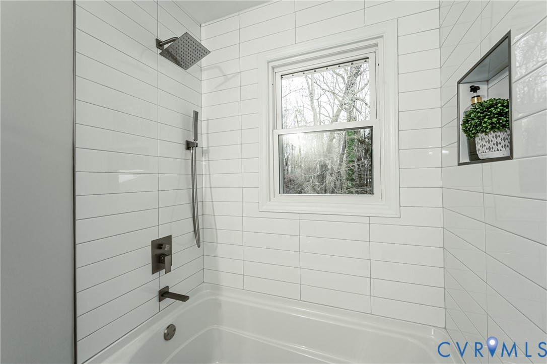 11251 Celtic Road Chesterfield, VA 23838 - Photo 24 of 49 a bathroom with a bathtub and shower