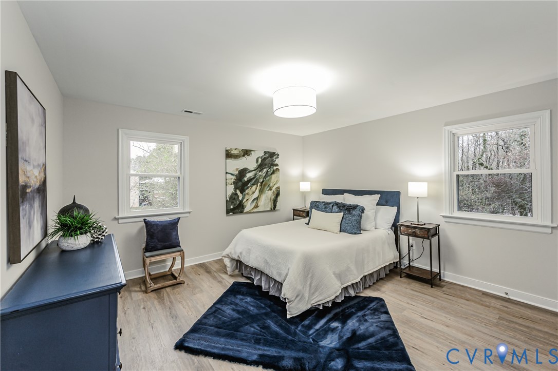 11251 Celtic Road Chesterfield, VA 23838 - Photo 28 of 49 a bedroom with a bed table chair and a window