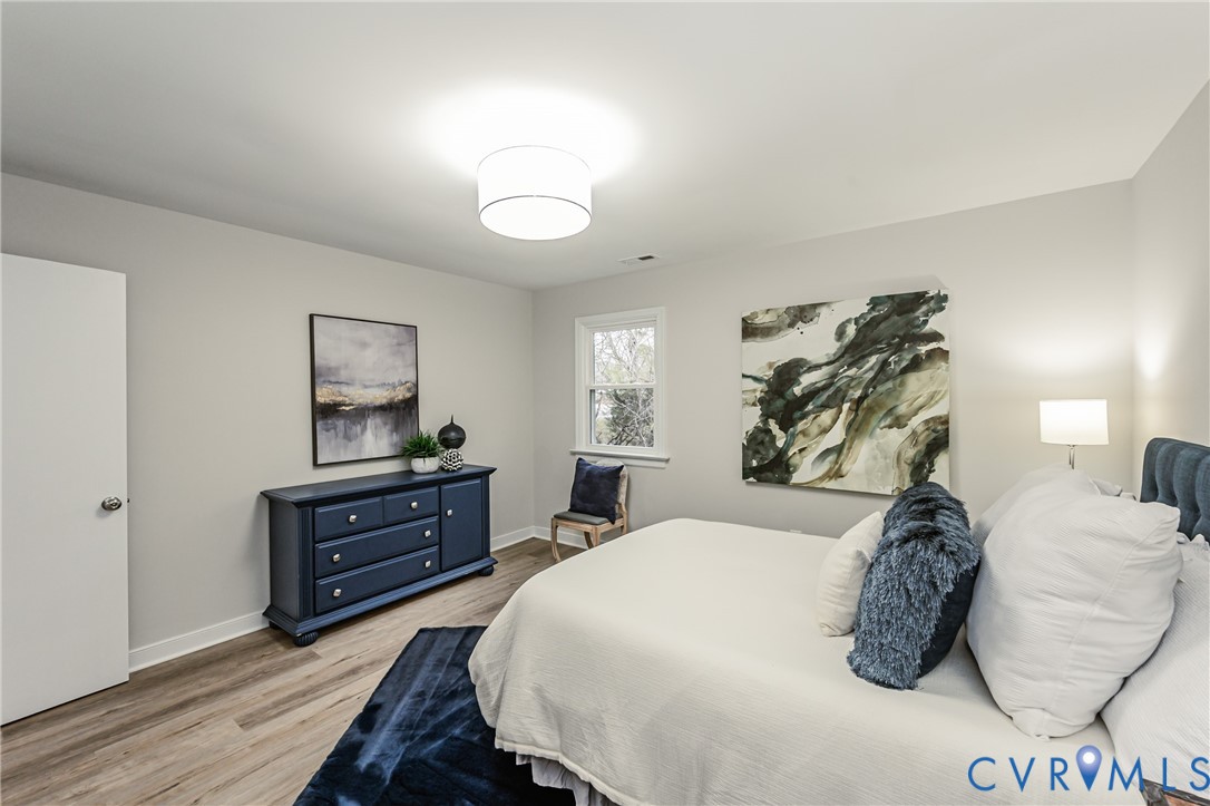 11251 Celtic Road Chesterfield, VA 23838 - Photo 29 of 49 a bedroom with a bed and a dresser
