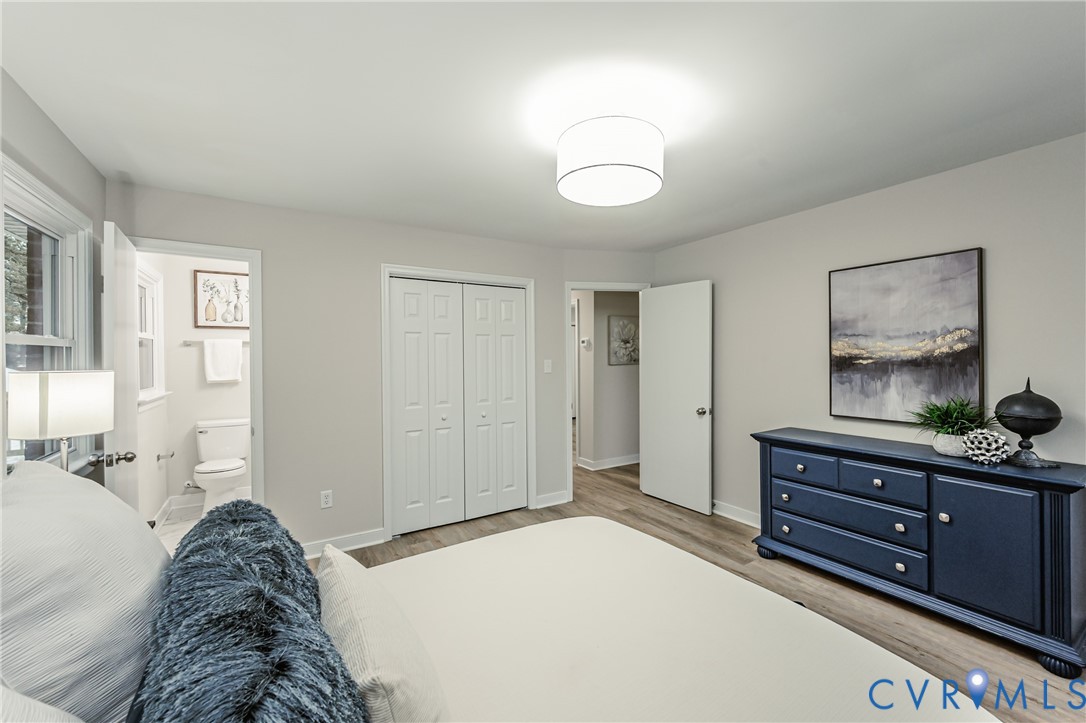 11251 Celtic Road Chesterfield, VA 23838 - Photo 31 of 49 a bedroom with a bed and wooden floor