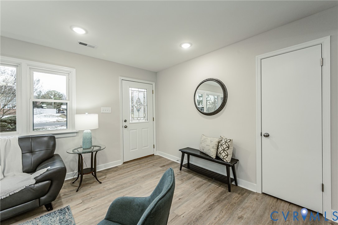 11251 Celtic Road Chesterfield, VA 23838 - Photo 4 of 49 a view of a livingroom with furniture wooden floor and a clock