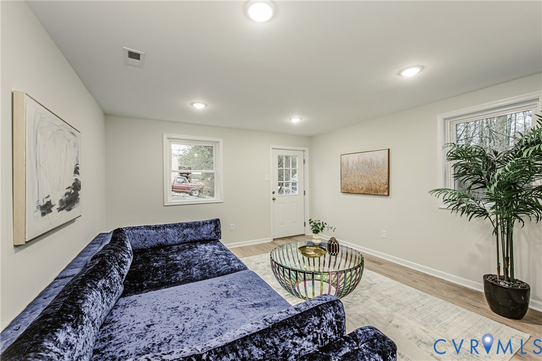 11251 Celtic Road Chesterfield, VA 23838 - Photo 43 of 49 a living room with furniture and a potted plant
