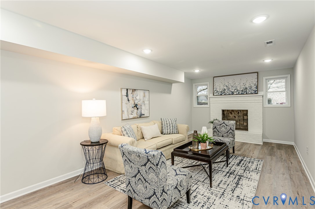 11251 Celtic Road Chesterfield, VA 23838 - Photo 46 of 49 a living room with furniture and a wooden floor