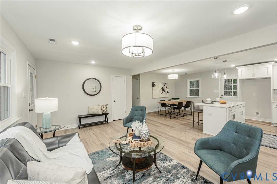 11251 Celtic Road Chesterfield, VA 23838 - Photo 8 of 49 a living room with furniture kitchen view and a mirror