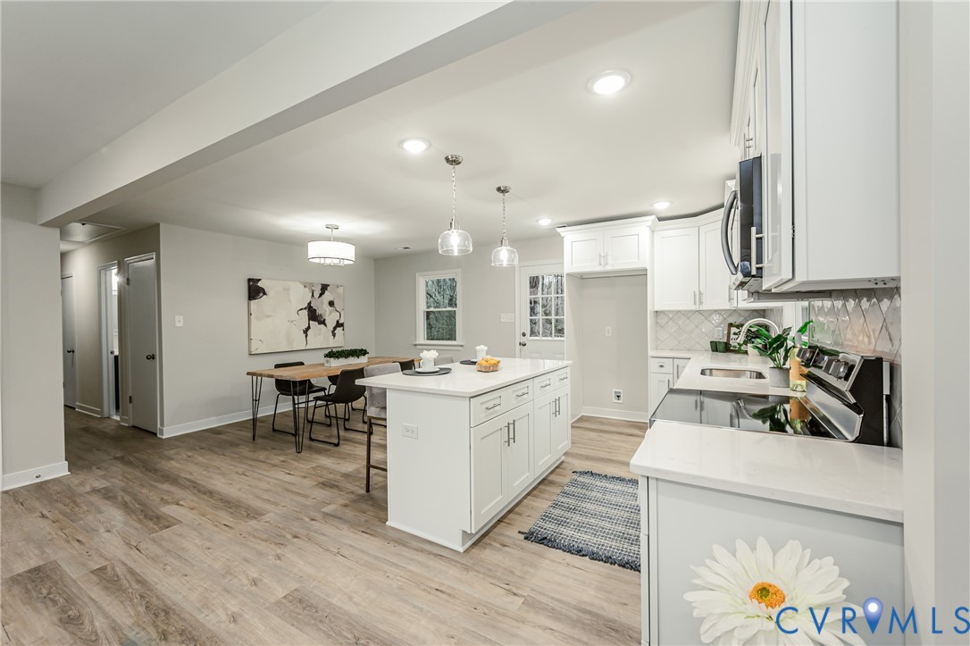 11251 Celtic Road Chesterfield, VA 23838 - Photo 9 of 49 a kitchen that has a lot of cabinets a sink and appliances in it