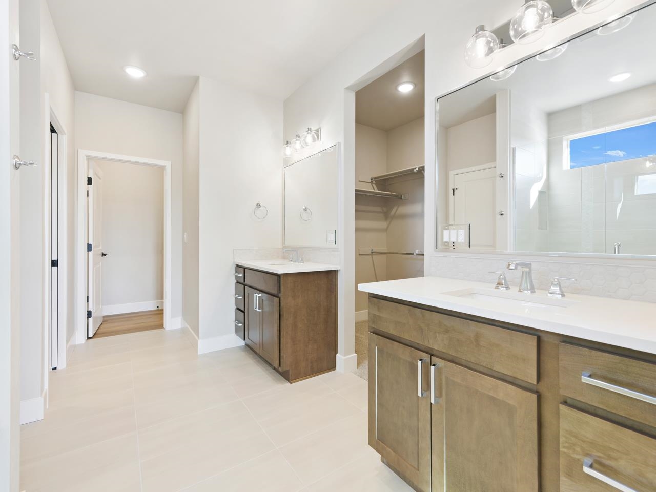 2267 Holy Cross Way Grand Junction, CO 81507 - Photo 20 of 36 a spacious bathroom with a granite countertop sink mirror and double