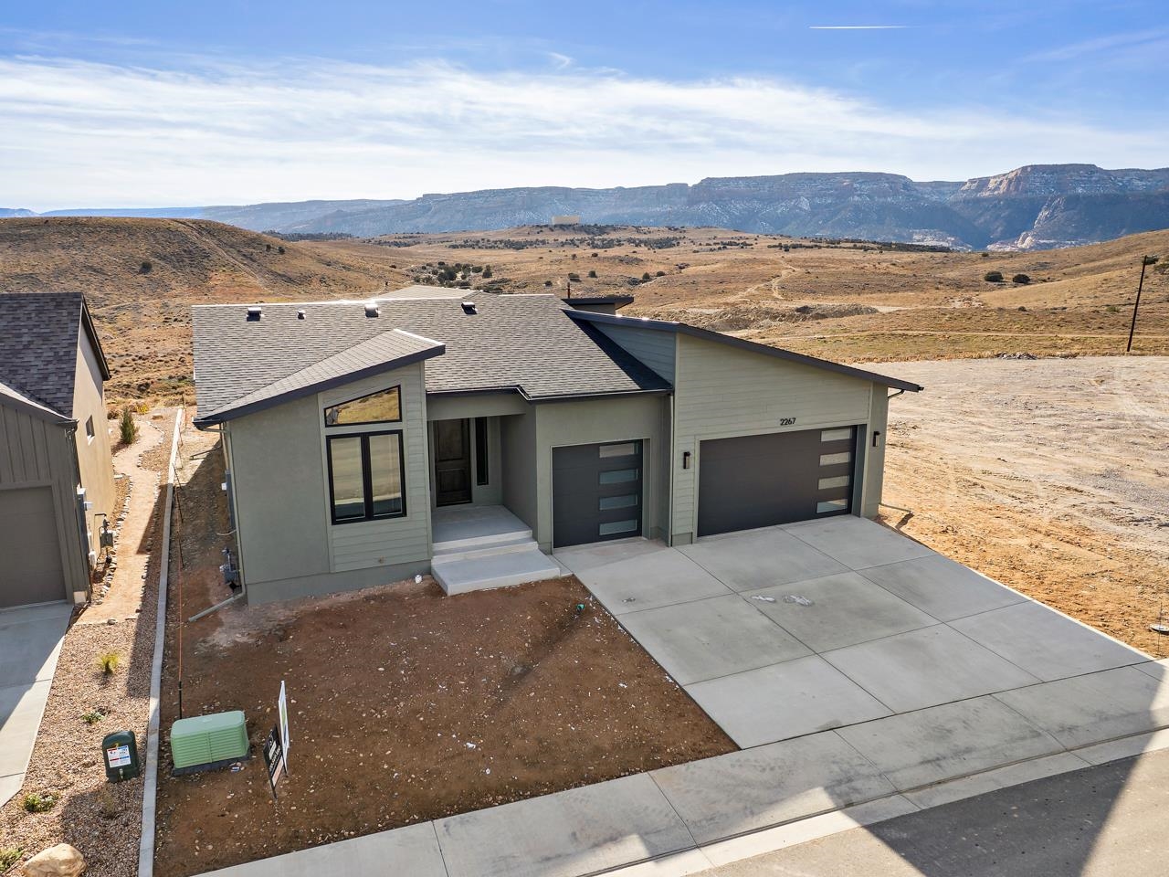 2267 Holy Cross Way Grand Junction, CO 81507 - Photo 4 of 36 a front view of a house with a lake view