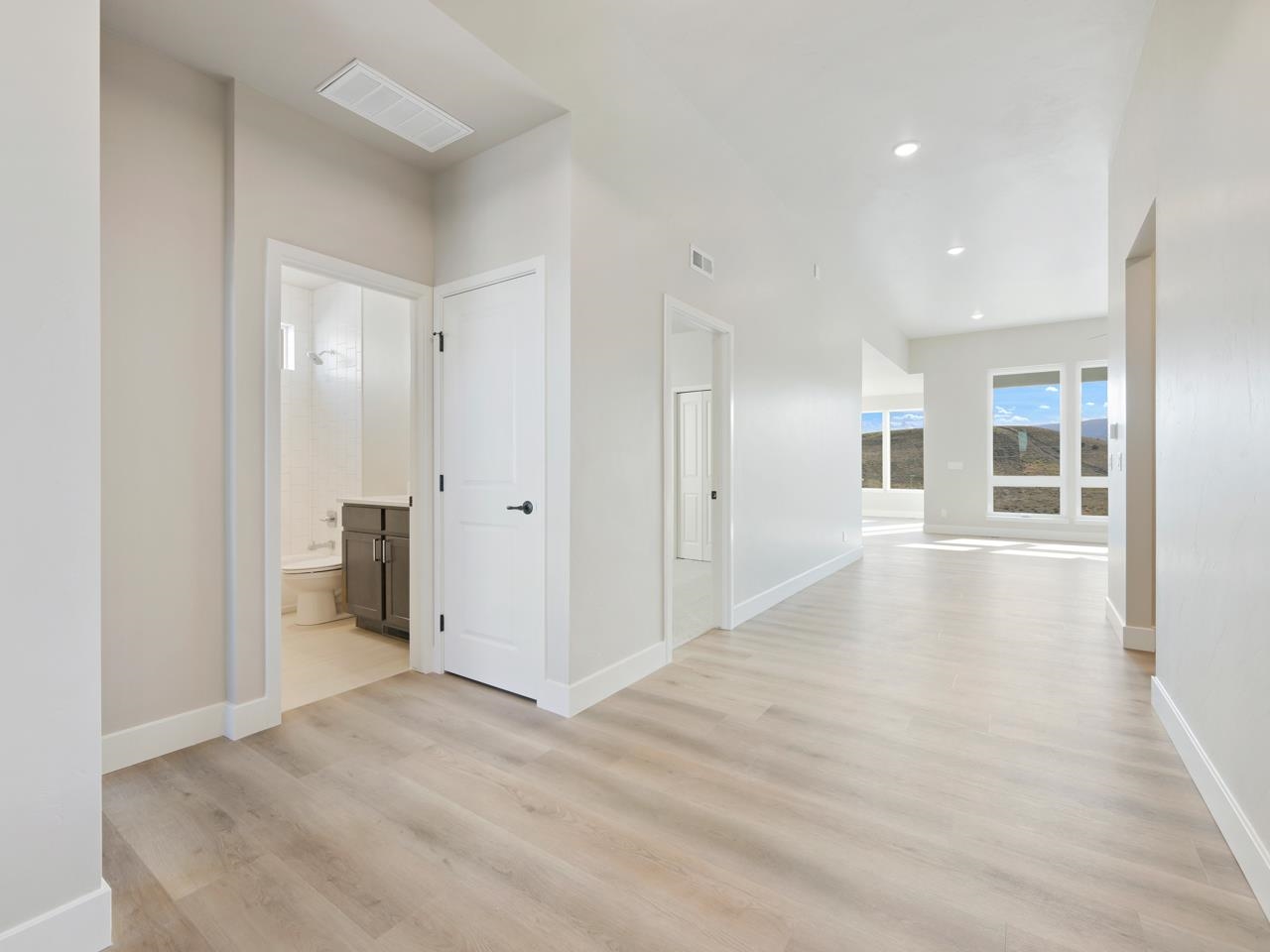 2267 Holy Cross Way Grand Junction, CO 81507 - Photo 5 of 36 a view of a big room with wooden floor and a bathroom