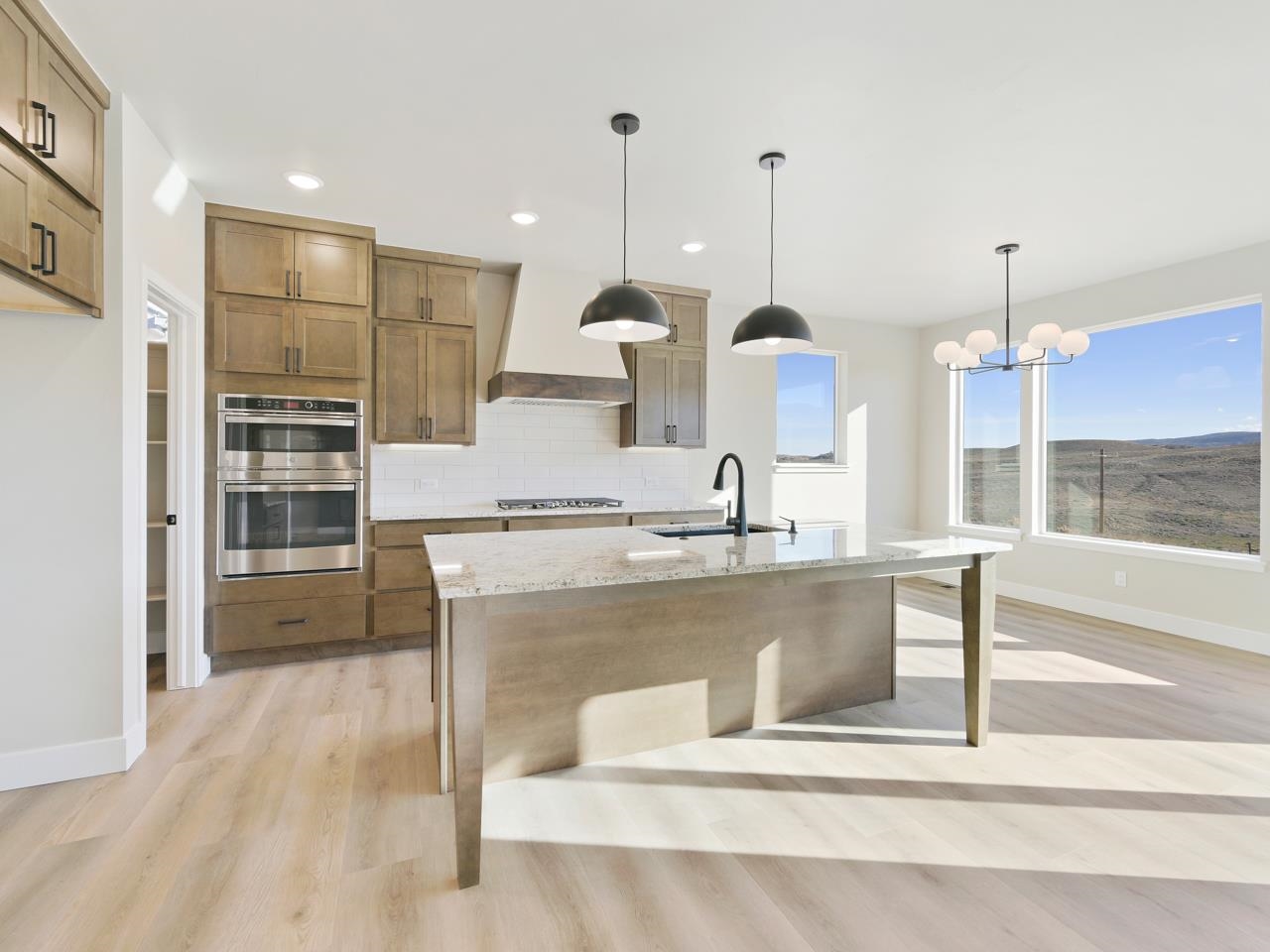 2267 Holy Cross Way Grand Junction, CO 81507 - Photo 9 of 36 a view of kitchen with stainless steel appliances granite countertop sink stove and refrigerator